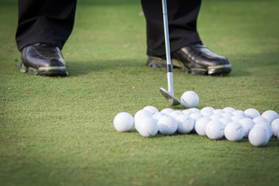 Young female golf player on course